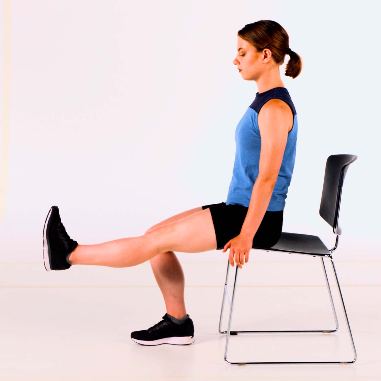 A person is doing leg flexion/extension exercises